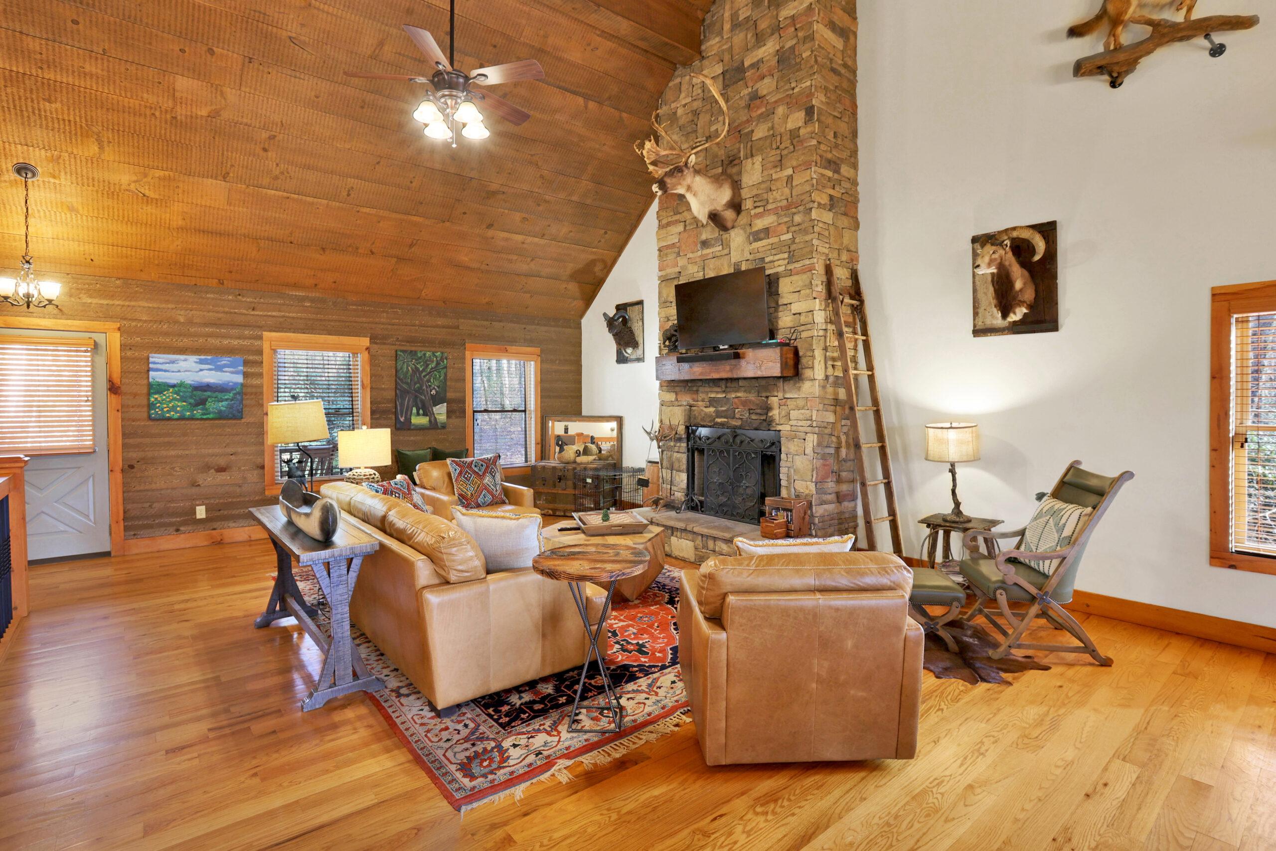 Gather around a warm and inviting fireplace like this one in one of our fully furnished mountain retreat homes with Barberry Retreats.